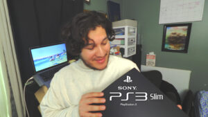 Chris Landeros holding on to a ps3 slim for jailbreaking